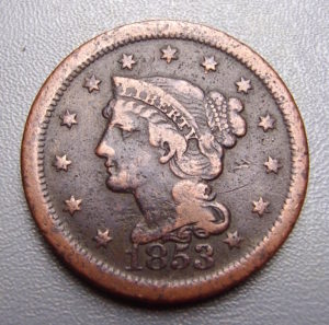 The face of an 1853 penny.